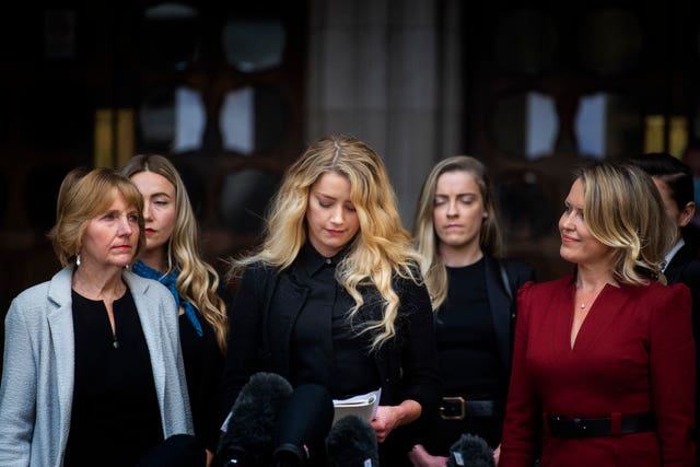 Actress Amber Heard, alongside her sister Whitney Henriquez (second right) and lawyer Jen Robinson (right), as she gives a statement outside the High Court in London on the final day of hearings in Johnny Depp’s libel case against the publishers of The Sun and its executive editor, Dan Wootton. After almost three weeks, the biggest English libel trial of the 21st century is drawing to a close, as Mr Depp’s lawyers are making closing submissions to Mr Justice Nicol 