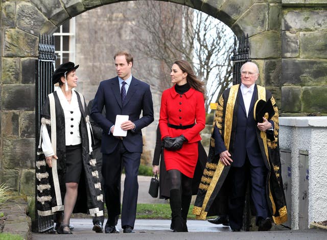 Prince William and Kate Middleton pass St Salvator’s halls, accompanied by Sir Menzies Campbell (right), during their return visit (Andrew Milligan/PA)