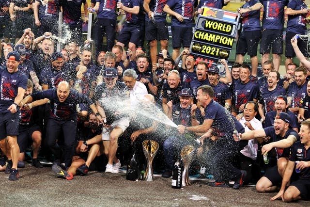 Max Verstappen (centre) celebrates with his Red Bull team