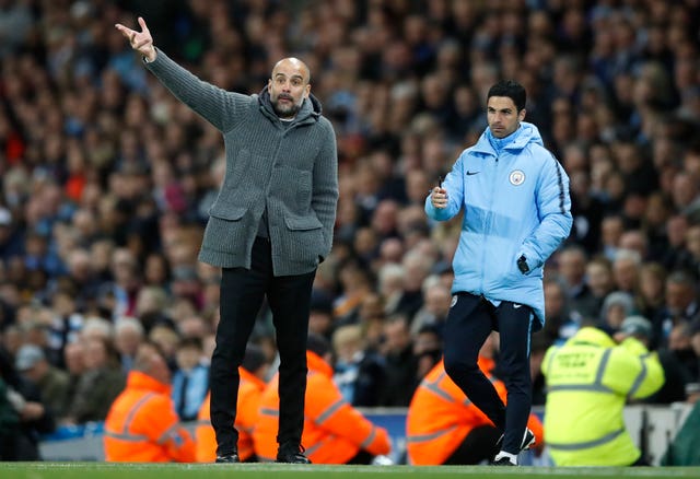 Pep Guardiola, left, believes he learned a lot from Mikel Arteta (Martin Rickett/PA)