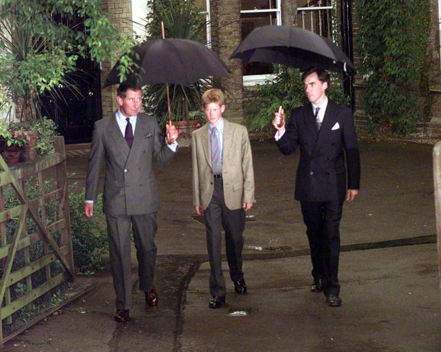 File photo dated 02/09/98 of Andrew Gailey, Housemaster of Manor House, meeting Prince Harry (now the Duke of Sussex) and the Prince of Wales (now King Charles III) at Eton College, Berkshire, arriving on his first day joining the school as a boarder 
