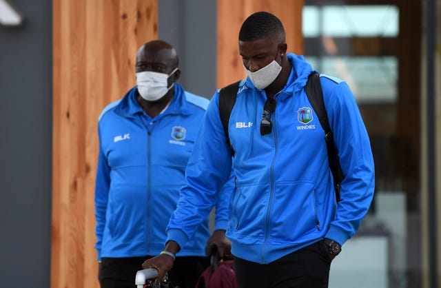 Holder and coach Roddy Estwick on arrival in Manchester.