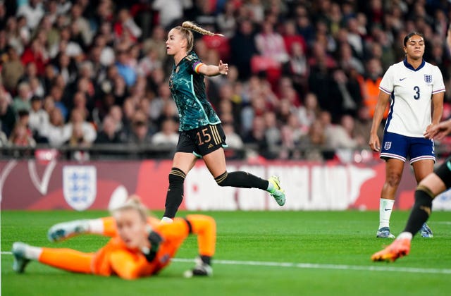 Germany’s Giulia Gwinn, centre, celebrates her second goal as goalkeeper Hannah Hampton dives in vain