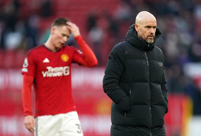 Erik Ten Hag, right, and Scott McTominay react at the end of the defeat by Fulham