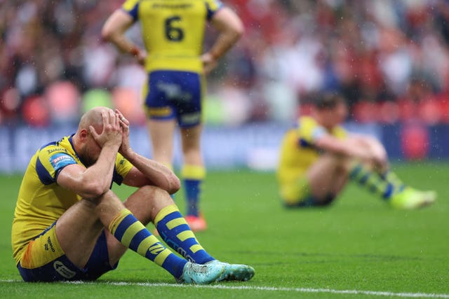 Warrington's James Harrison sits with his head in his hands