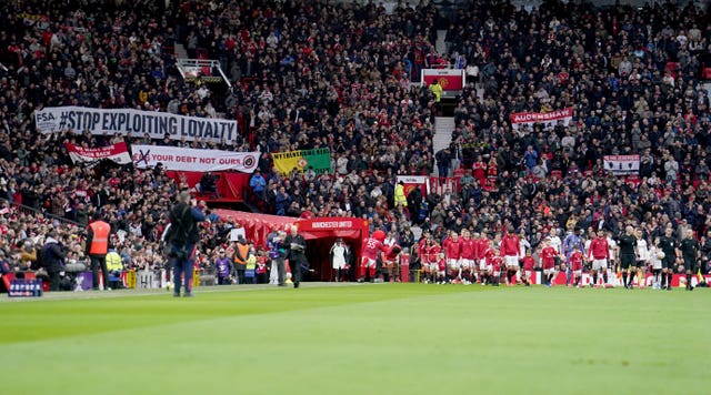 Protest banners were held up at Old Trafford on Sunday