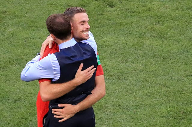 Henderson embraces manager Gareth Southgate after the win over Sweden