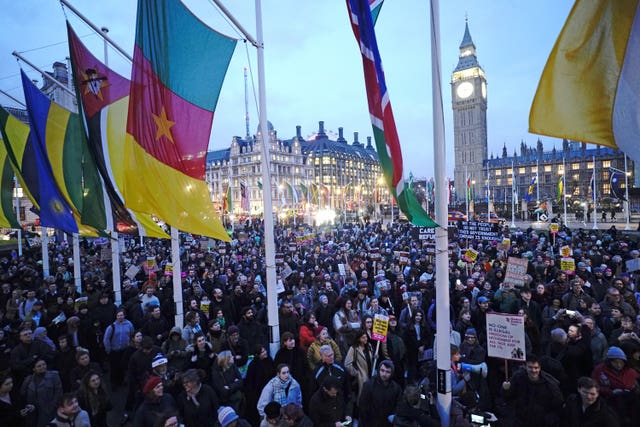 Demonstrators protest against the Illegal Migration Bill in Parliament Square, London, during the second reading of the bill in the House of Commons on Monday 