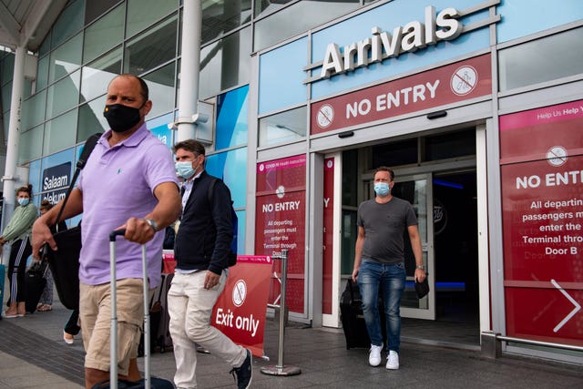 Passengers flying from Malaga arrive at Birmingham Airport