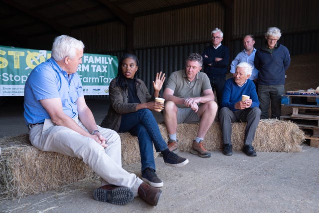 Conservative Party leader Kemi Badenoch speaks to farmers during her visit to Hall Farm in Little Walden, Essex