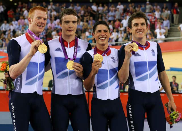 Great Britain’s Ed Clancy (left), Geraint Thomas (right), Steven Burke (second left) and Peter Kennaugh celebrate with their gold medals after the men’s team pursuit final at the London Olympics