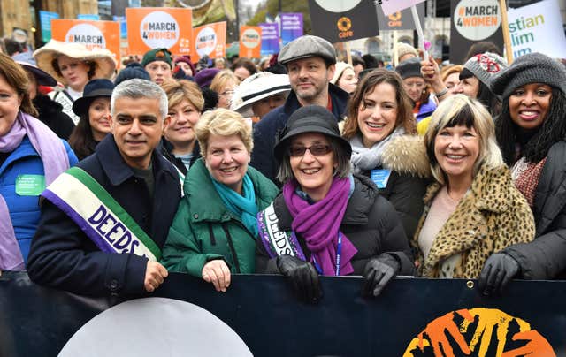 Michael Sheen stands behind Helen Pankhurst at the start of the March4Women (Dominic Lipinski/PA)