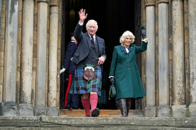 King Charles III and the Queen Consort wave as they leave Dunfermline Abbey, after a visit to mark its 950th anniversary, and after attending a meeting at the City Chambers in Dunfermline, Fife, where the King formally marked the conferral of city status on the former town 