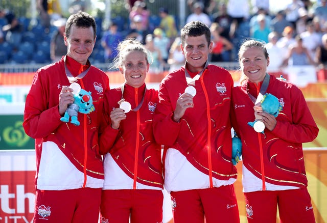 England’s Alistair Brownlee (left) Jessica Learmonth, Jonathan Brownlee and Vicky Holland celebrate taking silver in the mixed team relay triathlon final at the Southport Broadwater Parklands 