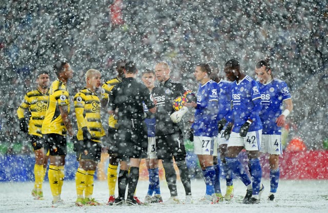 Leicester goalkeeper Kasper Schmeichel (centre) asks for a VAR check