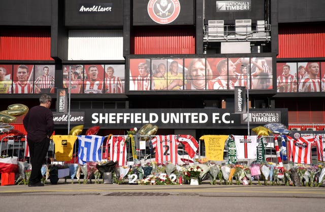 George Baldock tributes, including shirts and flowers, at Bramall Lane