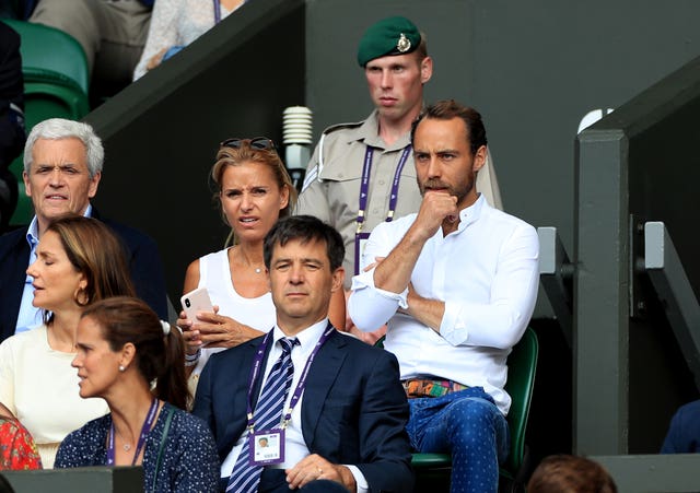 James Middleton and Alizee Thevenet seated among an audience at Wimbledon