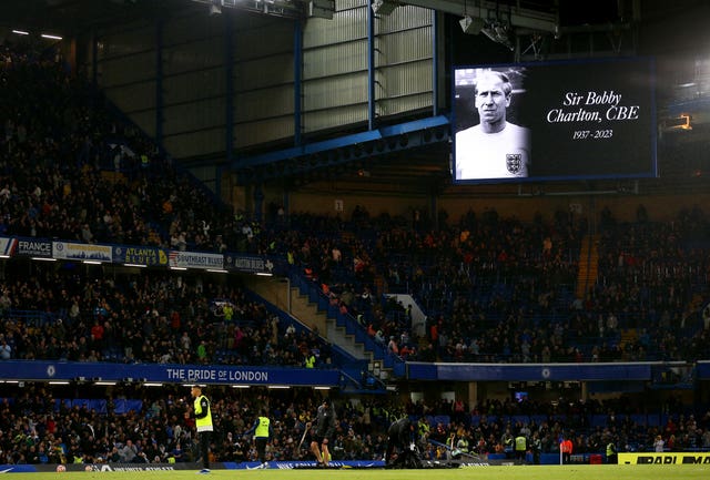 A tribute to Sir Bobby Charlton is displayed on screen at half-time during the Premier League match at Stamford Bridge