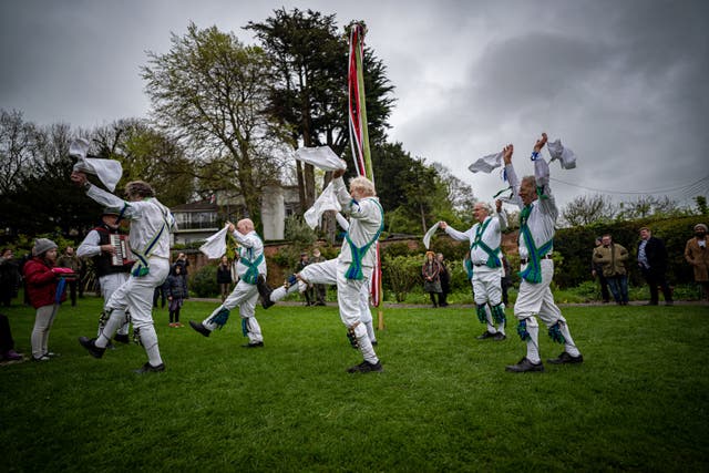 Morris men dance by the maypole at the Chalice Well