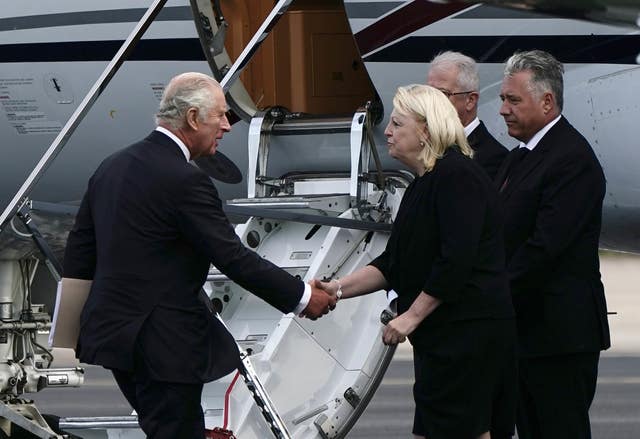 King Charles III (left) at Aberdeen Airport as he travels to London