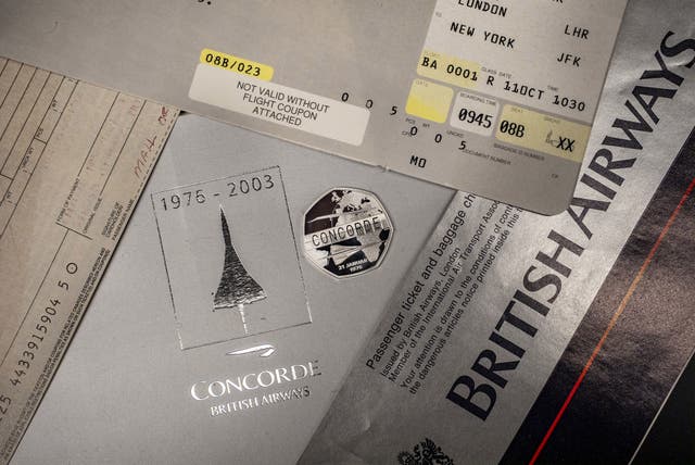 Concorde 50p coin on travel documents