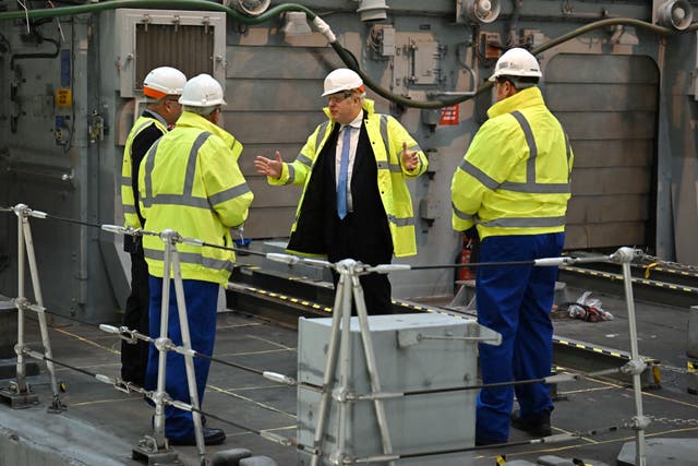 Boris Johnson is shown a vessel undergoing refit for the Ukrainian Navy during a visit to Rosyth Dockyard near Edinburgh