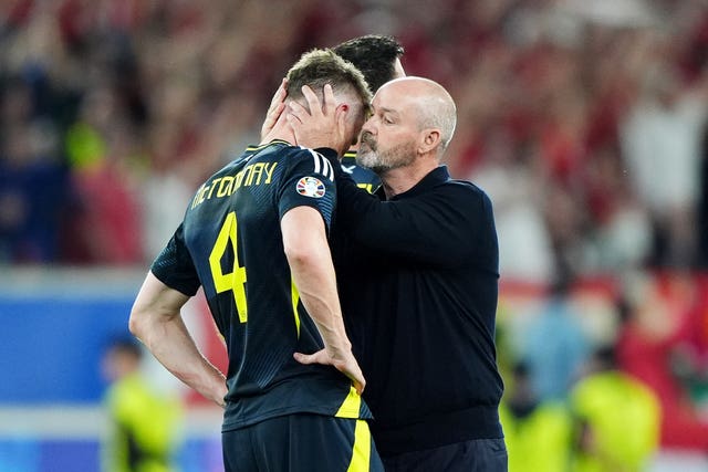 Scotland manager Steve Clarke (right) consoles Scott McTominay following the final Scotland match at the Euros 