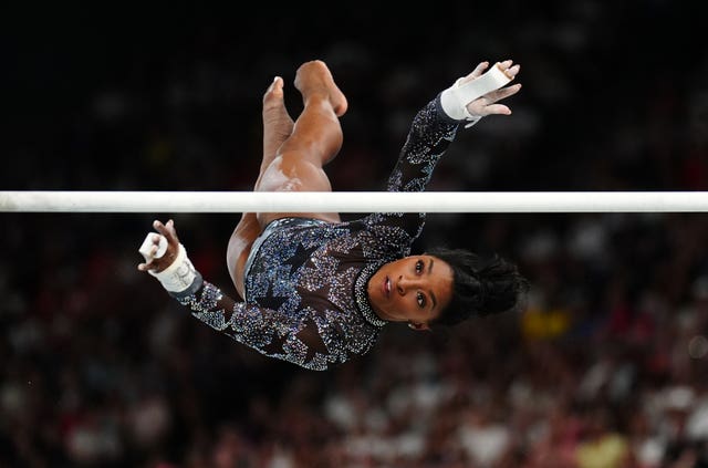 Simone Biles performing at the gymnastics