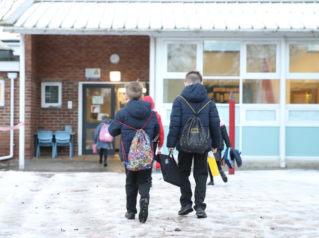 Children arrive for school