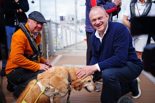 Steve Darling with his guide dog Jennie and the Liberal Democrat leader Sir Ed Davey 
