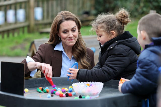 Princess of Wales playing outside with children