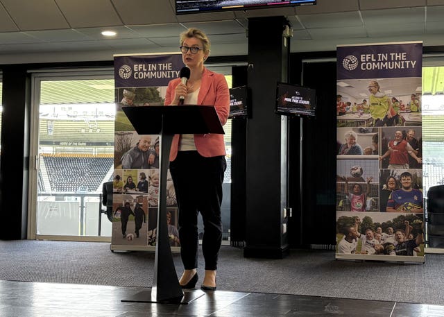Home Secretary Yvette Cooper standing behind a lectern 