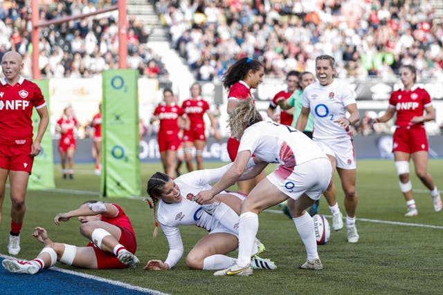 Jess Breach celebrates with Abigail Dow after scoring a try