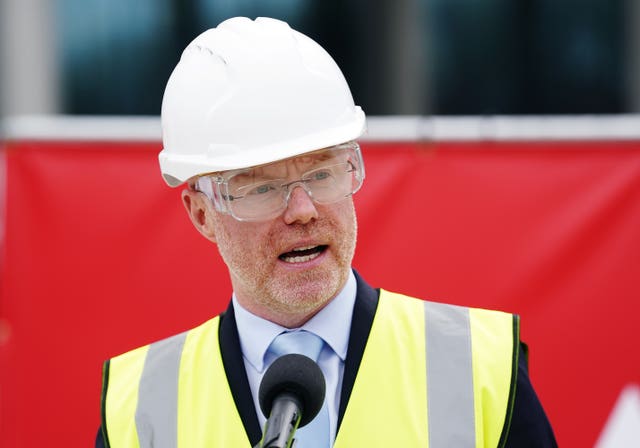 Stephen Donnelly in a white hard hat and hi-vis jacket