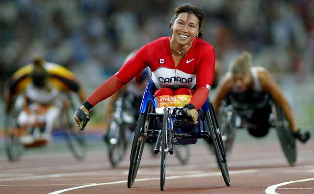 Chantal Petitclerc celebrates winning gold at the 2004 Paralympic Games in Athens