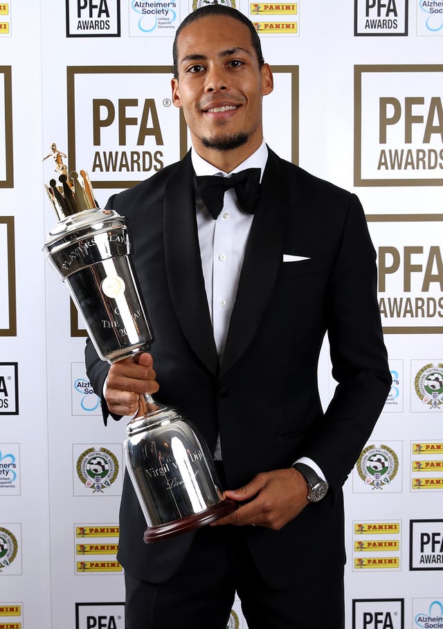 Liverpool’s Virgil van Dijk poses with his 2019 PFA Player of the Year award