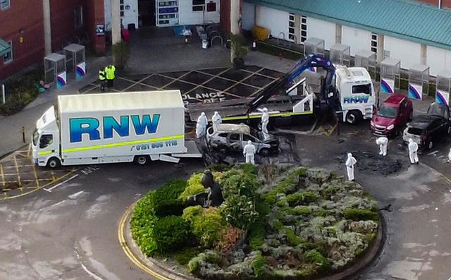 The burnt out taxi being removed from outside Liverpool Women's Hospital on Wednesday