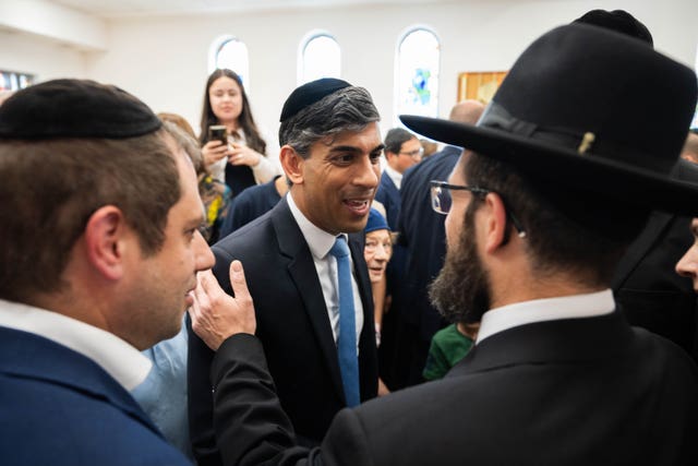 Prime Minister Rishi Sunak greets locals during a visit to Machzike Hadath Synagogue in Golders Green, London 