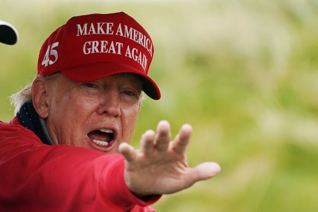 Donald Trump wearing a 'Make American great again hat'