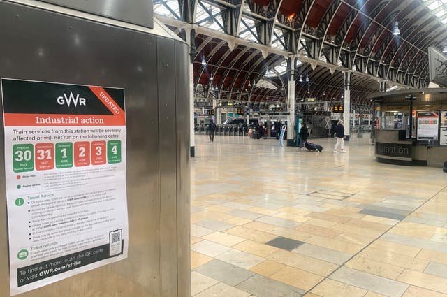 Strike signage in a quiet Paddington station in London