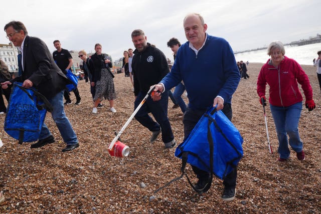 Sir Ed Davey taking part in a litter pick on Brighton Beach