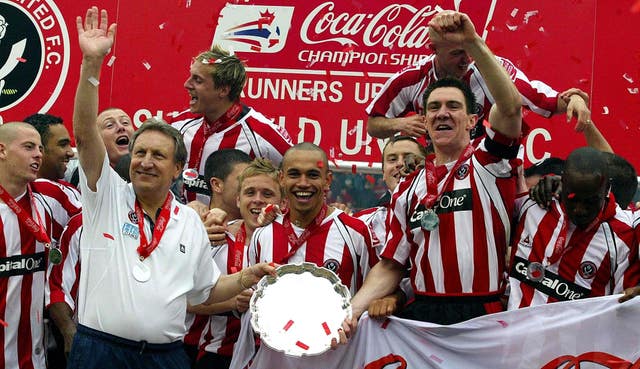 Warnock, front left, guided hometown club Sheffield United to the Premier League in 2006 