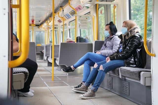 Passengers must now wear face masks on public transport (Owen Humphreys/PA)