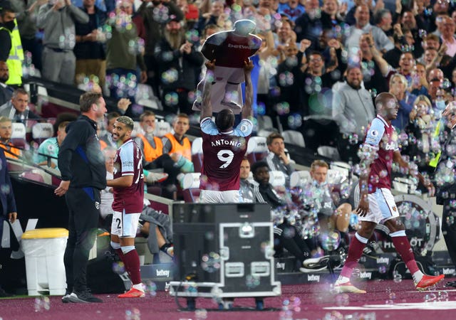 Michail Antonio celebrates with a cardboard cut-out