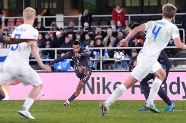 Trent Alexander-Arnold scores a free-kick for England against Finland