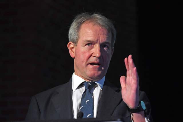 Owen Paterson gestures using his left hand