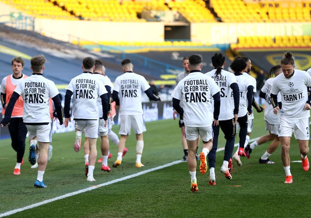 Leeds players wearing ‘Football Is For The Fans’ shirts during the warm up prior to kick-off against Liverpool
