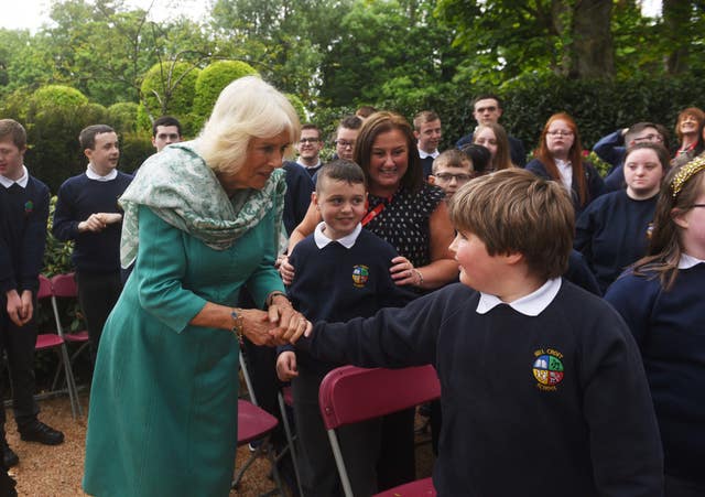 Camilla met children from Hill Croft school during a visit to open a new Coronation Garden in Newtownabbey in May 2023