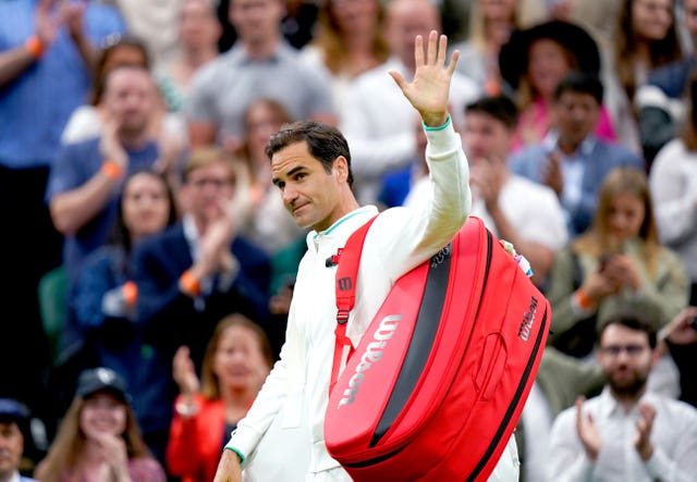 Roger Federer waves to the Centre Court crowd