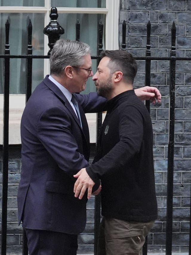 Volodymyr Zelensky embraces Sir Keir Starmer